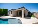 Spacious covered patio with ceiling fan, connecting to a pool and featuring an artificial lawn at 4341 W Pelotazo Way, San Tan Valley, AZ 85144