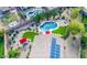 Aerial view of a well-maintained backyard with pool, seating area, lush landscaping, and solar panels at 6731 S 37Th Dr, Phoenix, AZ 85041