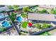 Aerial shot highlighting a backyard featuring a pool, outdoor seating, lush grass and desert landscaping at 6731 S 37Th Dr, Phoenix, AZ 85041