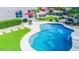 Inviting backyard with a sparkling pool, lush landscaping, patio seating, and charming outdoor grill at 6731 S 37Th Dr, Phoenix, AZ 85041