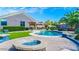 Backyard featuring a pool, seating, a manicured lawn, and desert landscaping for relaxing outdoor living at 6731 S 37Th Dr, Phoenix, AZ 85041