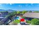 Aerial view showcases a private backyard with pool, patio, manicured landscaping, and mountain views in the distance at 6731 S 37Th Dr, Phoenix, AZ 85041