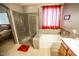 Modern bathroom featuring a separate shower and soaking tub and stylish tile at 6731 S 37Th Dr, Phoenix, AZ 85041