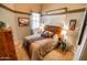 Neutral bedroom showcasing a queen bed and decor at 6731 S 37Th Dr, Phoenix, AZ 85041