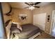 Bedroom features a queen bed, bull horns wall decoration, and closet at 6731 S 37Th Dr, Phoenix, AZ 85041