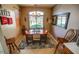 This dining room has a chandelier, window with blinds, and a rug at 6731 S 37Th Dr, Phoenix, AZ 85041
