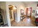 Foyer with art, a hallway, and access to the kitchen at 6731 S 37Th Dr, Phoenix, AZ 85041