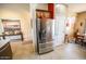 Stainless steel refrigerator in a well-lit kitchen area near a dining table at 6731 S 37Th Dr, Phoenix, AZ 85041