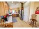 Open kitchen layout with wood cabinets and stainless-steel appliances seamlessly connecting to the rest of the house at 6731 S 37Th Dr, Phoenix, AZ 85041