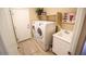 Laundry room with modern appliances, sink, and ample storage space at 6731 S 37Th Dr, Phoenix, AZ 85041