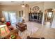 Open floor plan living room featuring a built in shelving unit and view of the patio at 6731 S 37Th Dr, Phoenix, AZ 85041