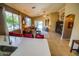 Well-lit living room with tile floors and large windows overlooking the backyard at 6731 S 37Th Dr, Phoenix, AZ 85041