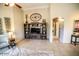 Living room featuring a built in shelving unit, decorations, and view of hallway at 6731 S 37Th Dr, Phoenix, AZ 85041