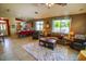 Open floor plan living room that flows to the kitchen and has lots of light at 6731 S 37Th Dr, Phoenix, AZ 85041