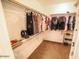 Organized walk-in closet with shelving, hanging racks, and ample storage space for clothes and accessories at 6731 S 37Th Dr, Phoenix, AZ 85041