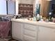 A bathroom with double sinks and a window at 6960 W Peoria Ave # 156, Peoria, AZ 85345