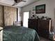 Calm bedroom with laminate flooring and a large window providing ample natural light at 6960 W Peoria Ave # 156, Peoria, AZ 85345