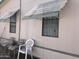 Inviting home exterior featuring awnings and outdoor seating at 6960 W Peoria Ave # 156, Peoria, AZ 85345