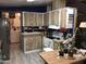 Functional kitchen featuring wood cabinets, stainless steel appliances and laminate flooring at 6960 W Peoria Ave # 156, Peoria, AZ 85345