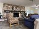 Inviting living room with a stunning stone fireplace and comfortable seating for relaxing or entertaining at 6960 W Peoria Ave # 156, Peoria, AZ 85345