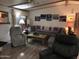 Cozy living room featuring comfortable seating, neutral paint and wood-look laminate flooring at 6960 W Peoria Ave # 156, Peoria, AZ 85345