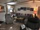 Cozy living room featuring comfortable seating, neutral paint and wood-look laminate flooring at 6960 W Peoria Ave # 156, Peoria, AZ 85345
