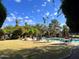 Community pool featuring well-manicured greenery, lounge chairs, and a serene outdoor atmosphere at 6960 W Peoria Ave # 156, Peoria, AZ 85345