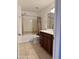 Bathroom with a tub, vanity, and tile floors at 708 N Country Club Way, Chandler, AZ 85226