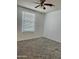 Cozy bedroom with neutral carpet and natural light from a bright window at 708 N Country Club Way, Chandler, AZ 85226