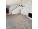 Spacious living room with new carpet, a fireplace, and easy access to the stairway at 708 N Country Club Way, Chandler, AZ 85226