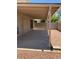Covered patio features concrete flooring and easy-to-maintain landscaping at 708 N Country Club Way, Chandler, AZ 85226