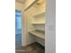 Walk-in closet space with carpet and built-in shelving at 708 N Country Club Way, Chandler, AZ 85226