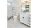 Modern bathroom featuring a new vanity, stylish mirror, and tiled shower with pebble flooring at 717 W Manhatton Dr, Tempe, AZ 85282