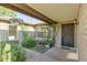 Inviting entryway with lush landscaping and decorative hanging plants, creating a warm welcome at 717 W Manhatton Dr, Tempe, AZ 85282