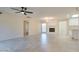 Open concept living space featuring tile flooring, a decorative fireplace, and an abundance of natural light at 717 W Manhatton Dr, Tempe, AZ 85282