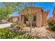 Charming exterior showcasing desert landscaping and a cozy front porch at 7413 W Southgate Ave, Phoenix, AZ 85043