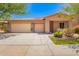 Charming single-story home featuring a three-car garage and desert landscaping at 7413 W Southgate Ave, Phoenix, AZ 85043