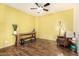 Bright living room with hardwood floors, rustic console table, and cozy seating area at 7413 W Southgate Ave, Phoenix, AZ 85043