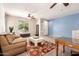 Inviting living room with a large window and modern decor at 7413 W Southgate Ave, Phoenix, AZ 85043
