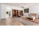 Open-concept living area with a built-in desk and neutral tile flooring at 7413 W Southgate Ave, Phoenix, AZ 85043