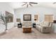 Cozy living room featuring a vaulted ceiling and modern decor at 7413 W Southgate Ave, Phoenix, AZ 85043