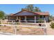 View of backyard featuring a garden, desert landscaping, partial fencing, and covered patio at 7730 E Culver St, Mesa, AZ 85207