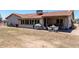 Backyard featuring a brick patio, outdoor seating, and xeriscape landscaping at 7730 E Culver St, Mesa, AZ 85207