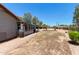 Large backyard with brick patio, and a glimpse of the horse arena at 7730 E Culver St, Mesa, AZ 85207