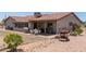 Backyard with patio seating, fire pit and desert landscaping at 7730 E Culver St, Mesa, AZ 85207