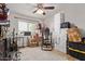 Bedroom with ample space can be used for storage or hobbies with a ceiling fan and good natural light at 7730 E Culver St, Mesa, AZ 85207