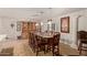 Elegant dining room with a large wooden table and ample seating for Gathering gatherings at 7730 E Culver St, Mesa, AZ 85207