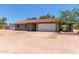 Single story home with a tile roof, 2-car garage, and desert landscaping at 7730 E Culver St, Mesa, AZ 85207