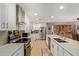 Bright kitchen featuring stainless steel appliances and a kitchen island with barstool seating at 7730 E Culver St, Mesa, AZ 85207
