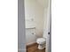 Clean bathroom with toilet, chrome towel bars, and modern flooring at 7801 N 44Th Dr # 1036, Glendale, AZ 85301